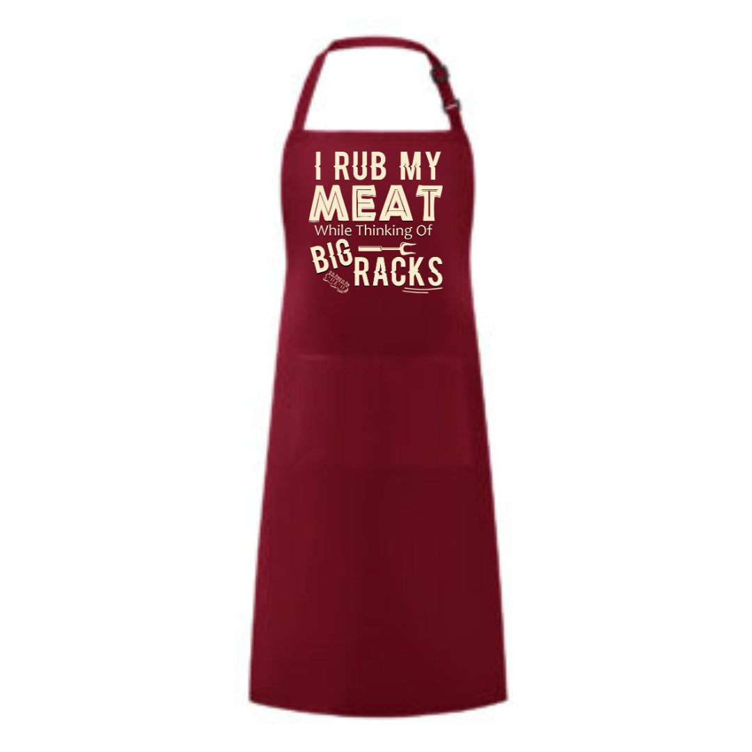 a red apron that says i rub my meat with the words